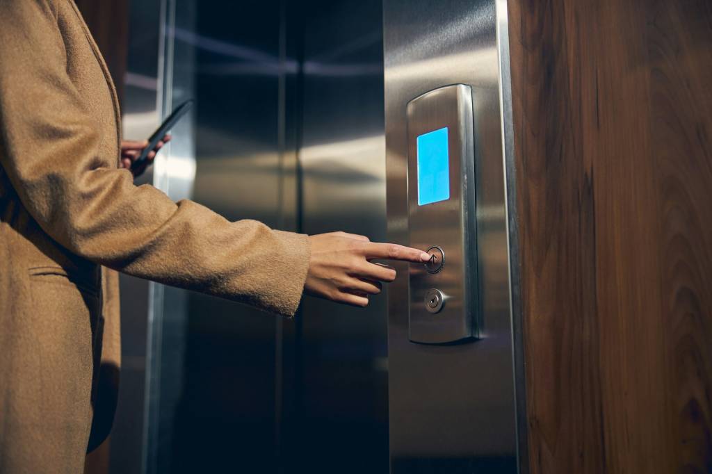 Woman wearing autumn clothes in the elevator